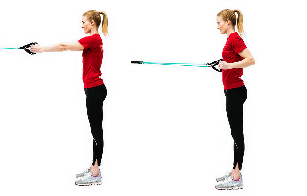 Woman doing standing rowing with elastic band