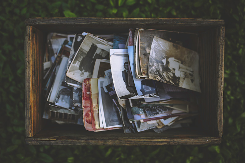 Old photographs in a box. Photo.