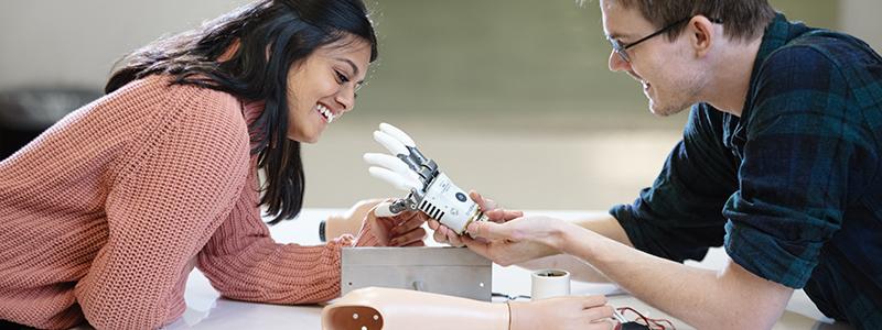 Picture of man and woman making an artificial arm