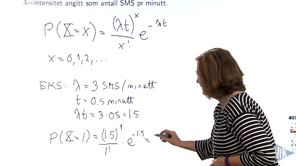 Woman writing equations on a board. Screenshot from video.