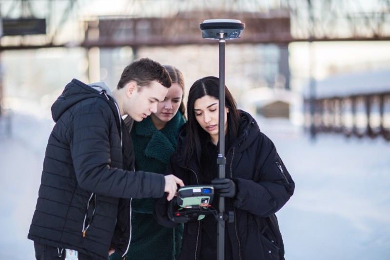 Picture of students with equipment for surveying