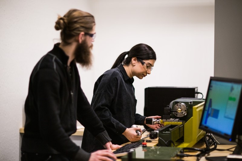 Picture of students in the machine lab