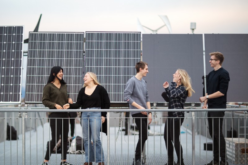 Picture of students in front of solar panel