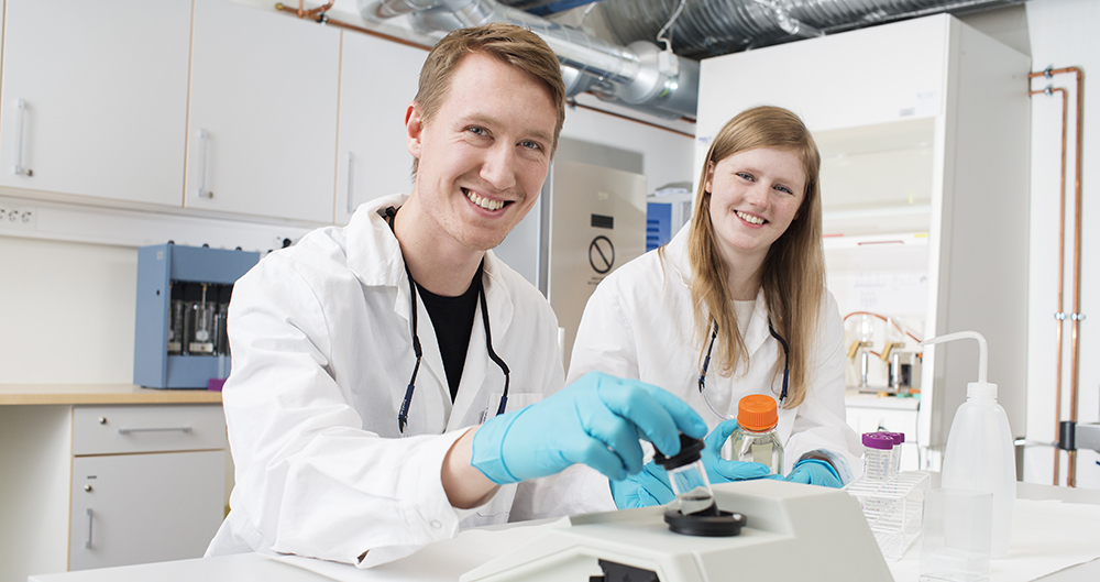 Smiling students at the laboratory