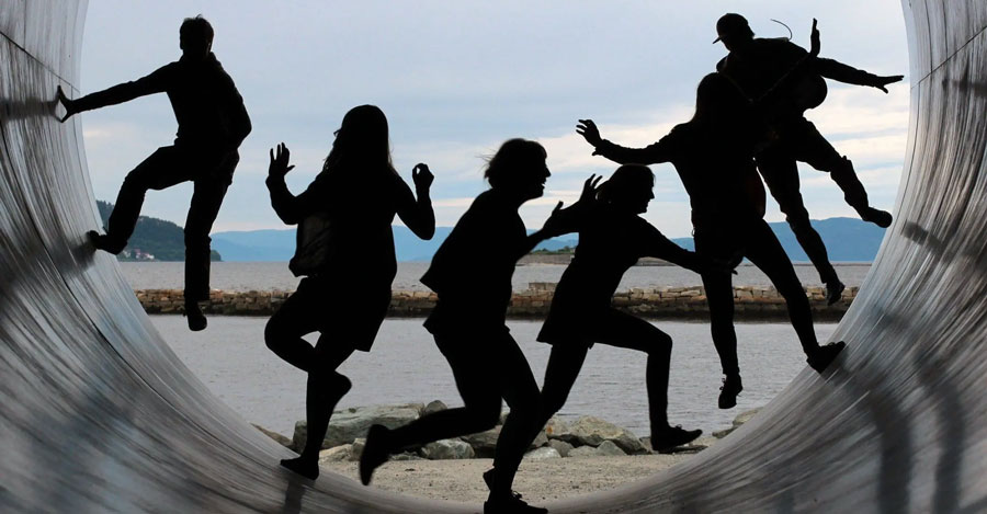 People running in a tunnel and the fjord. Photo
