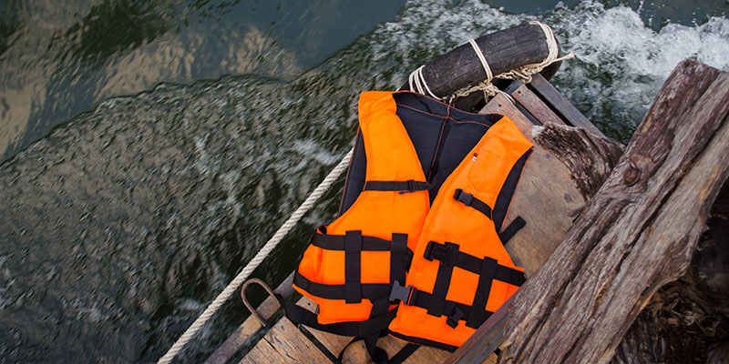 A lifevest on a dock. Photo.