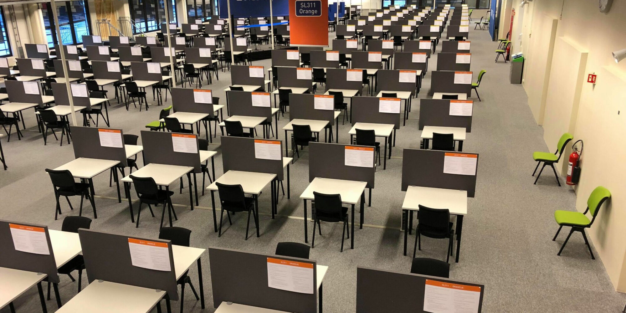 Empty tables in a room used for exams