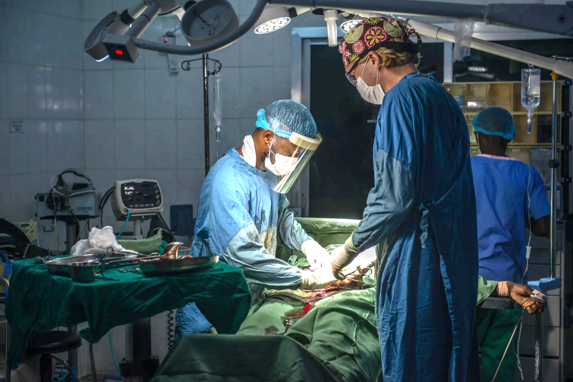 Surgeons in operating room doing a C-section