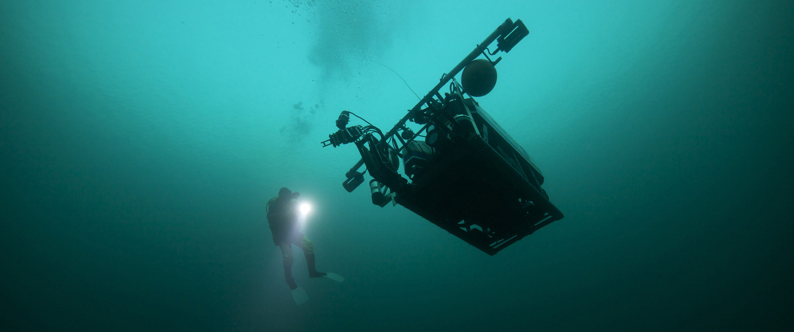 underwater photo of vehicle and a diver