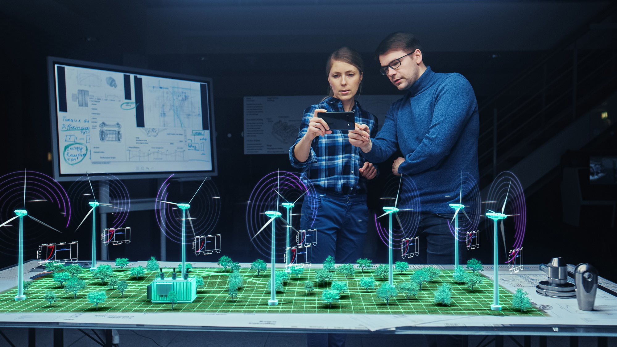 Students watching a model of wind mills