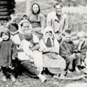 A family or a day care centre in 1891 or 1892. women, man and children