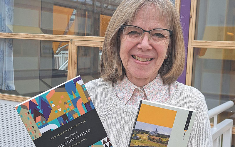 Professor Aud Mikkelsen Tretvik displays her two new books. Photo