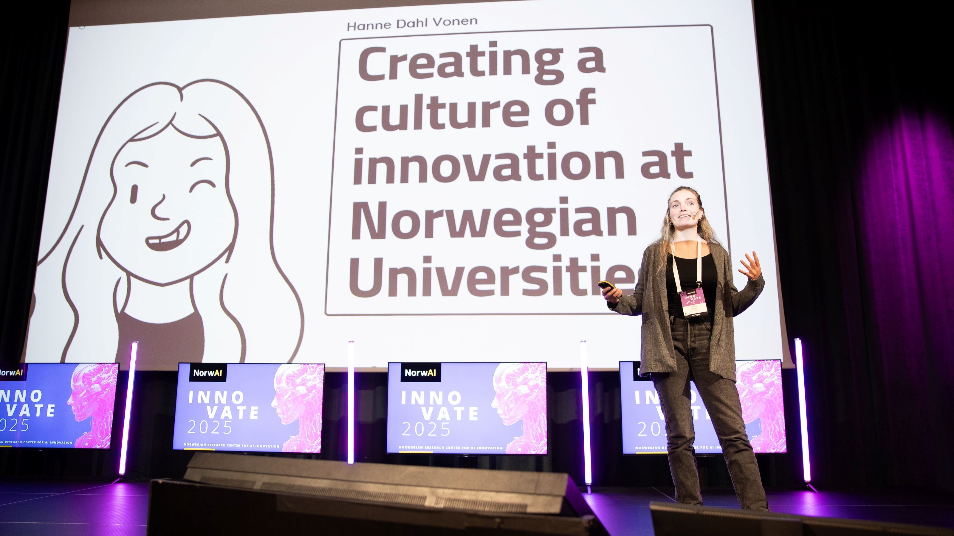 A woman presenting on a stage