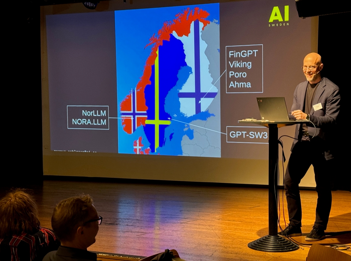 Magnus Sahlgren speaking on stage