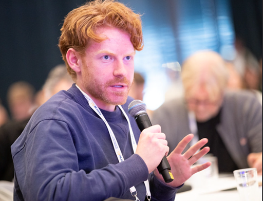 Man speaking into a microphone