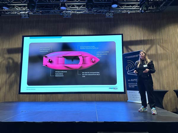 Bjørg Mathiesen Døving from Reach Subsea presenting the vessel Reach Remote 1 on stage.