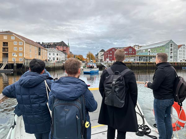 Participants at the SFI Days aboard the ferry milliAmpere2, viewing the docking of milliAmpere 1 at Ravnkloa in Trondheim. 
