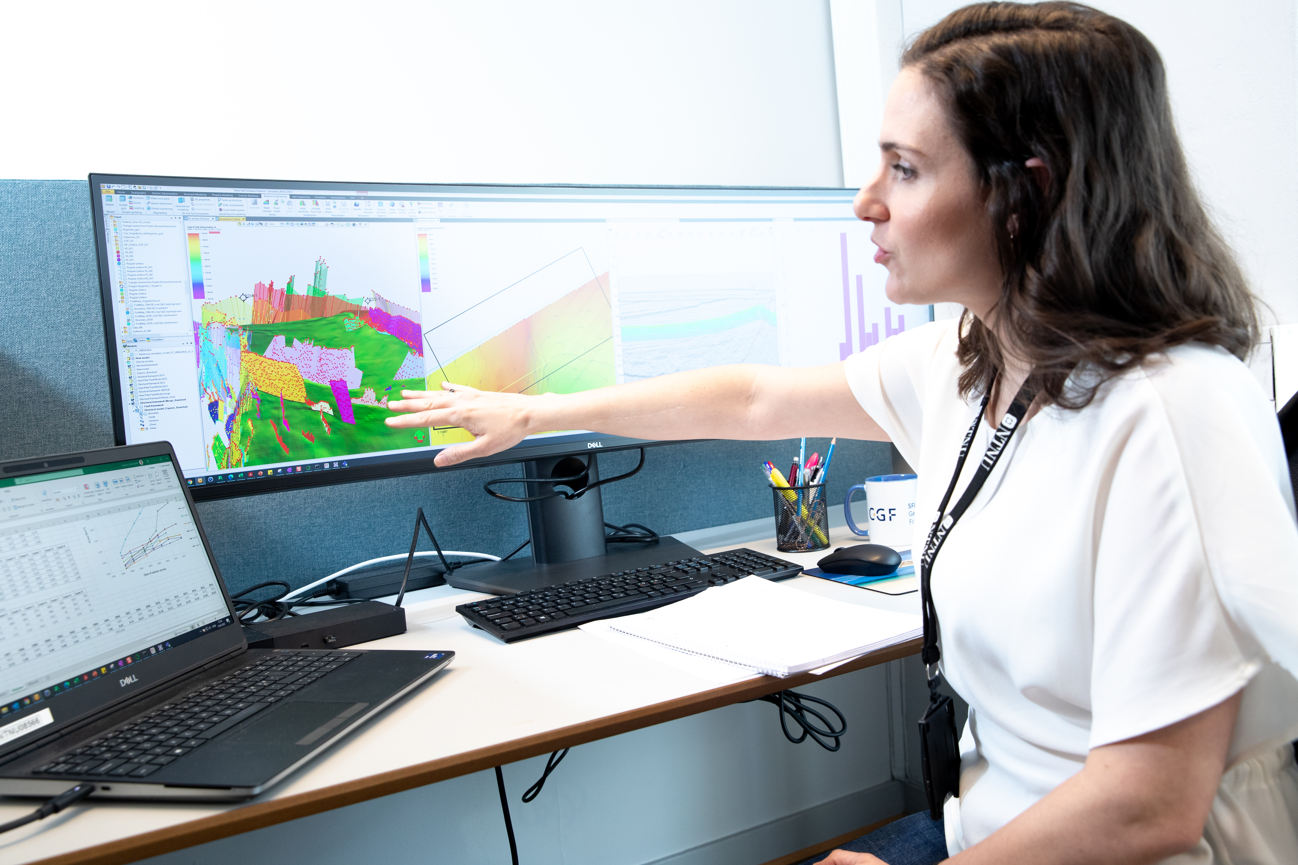 Researcher showing geophysical models on a computer screen. Photo