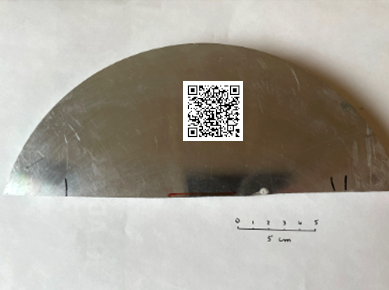 A metal item with a QR-code on it