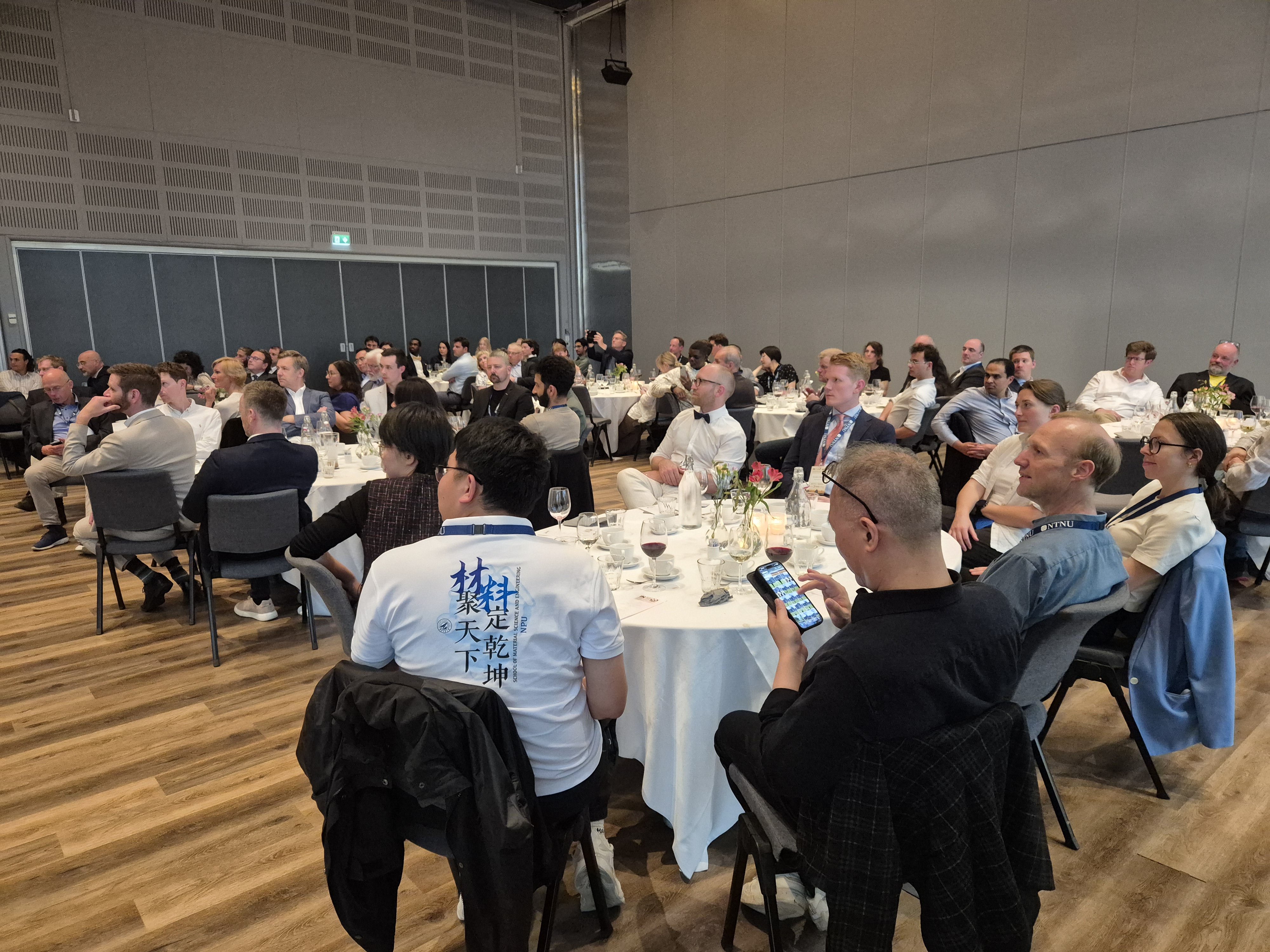 Groups of people sitting around tables.