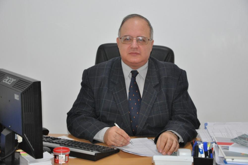 Professor Murgescu behind his desk
