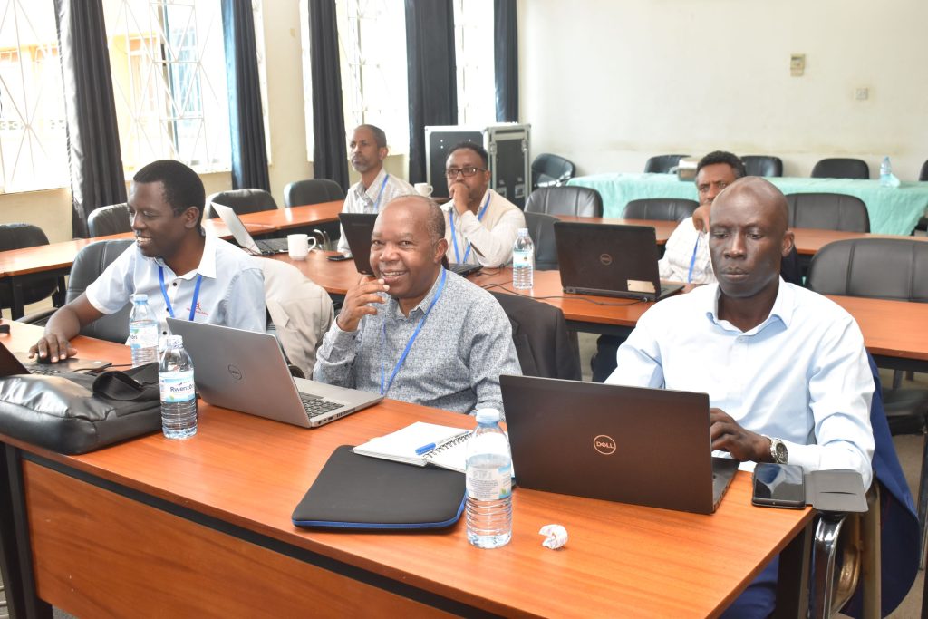 Dr. Nyeinga Karidewa (R) with representatives from other partner Universities at the Project workshop at Makerere University.