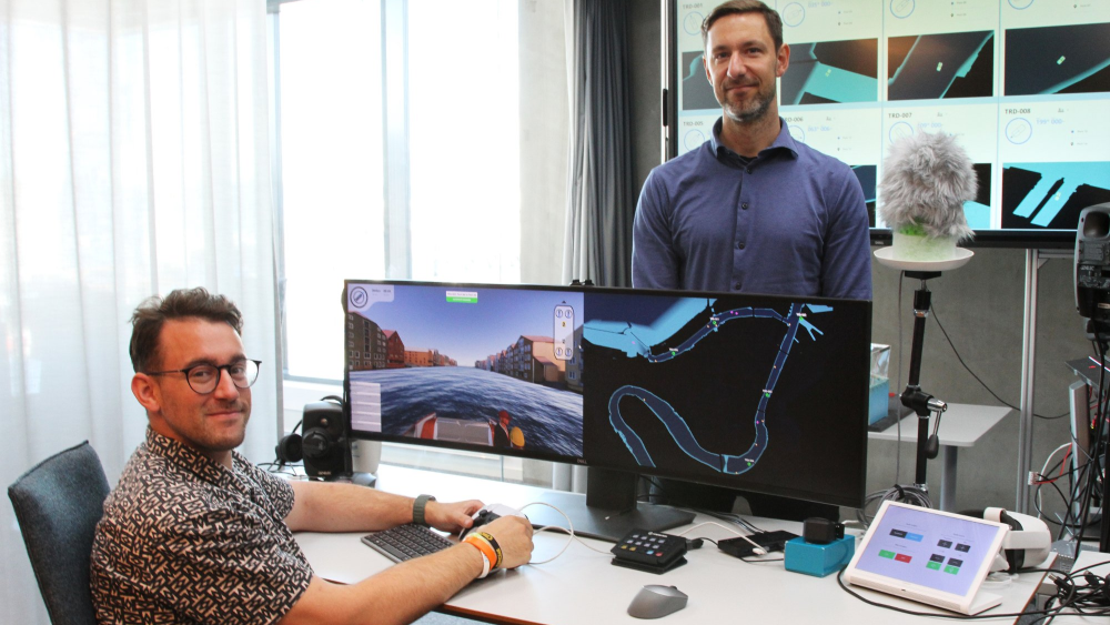 two researchers in front of screens