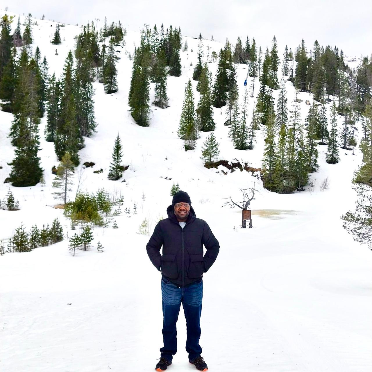 Person standing outside in the snow. Photo
