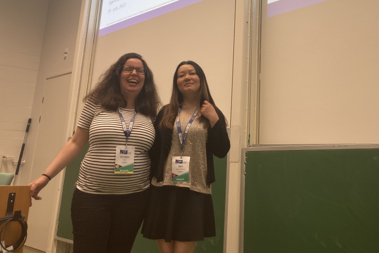 Two people standing together. Photo