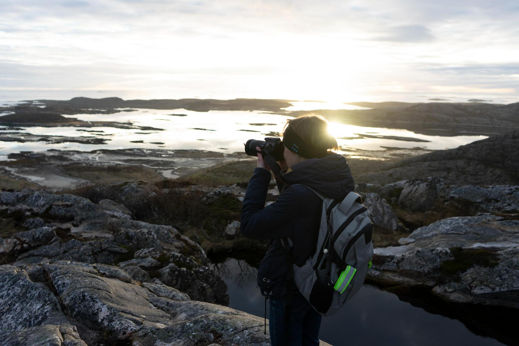 Person taking a photo, landscape around. Photo