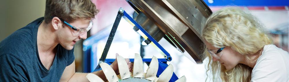 Students work with models of water turbines in the Hydropower Laboratory
