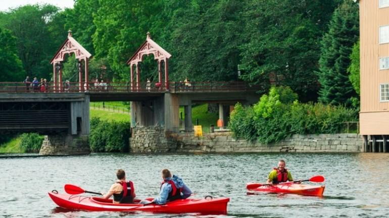 View from kayaking on a river through a city. Photo