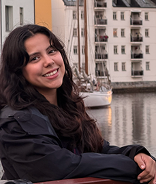 Portrait of student sitting by the water. Photo