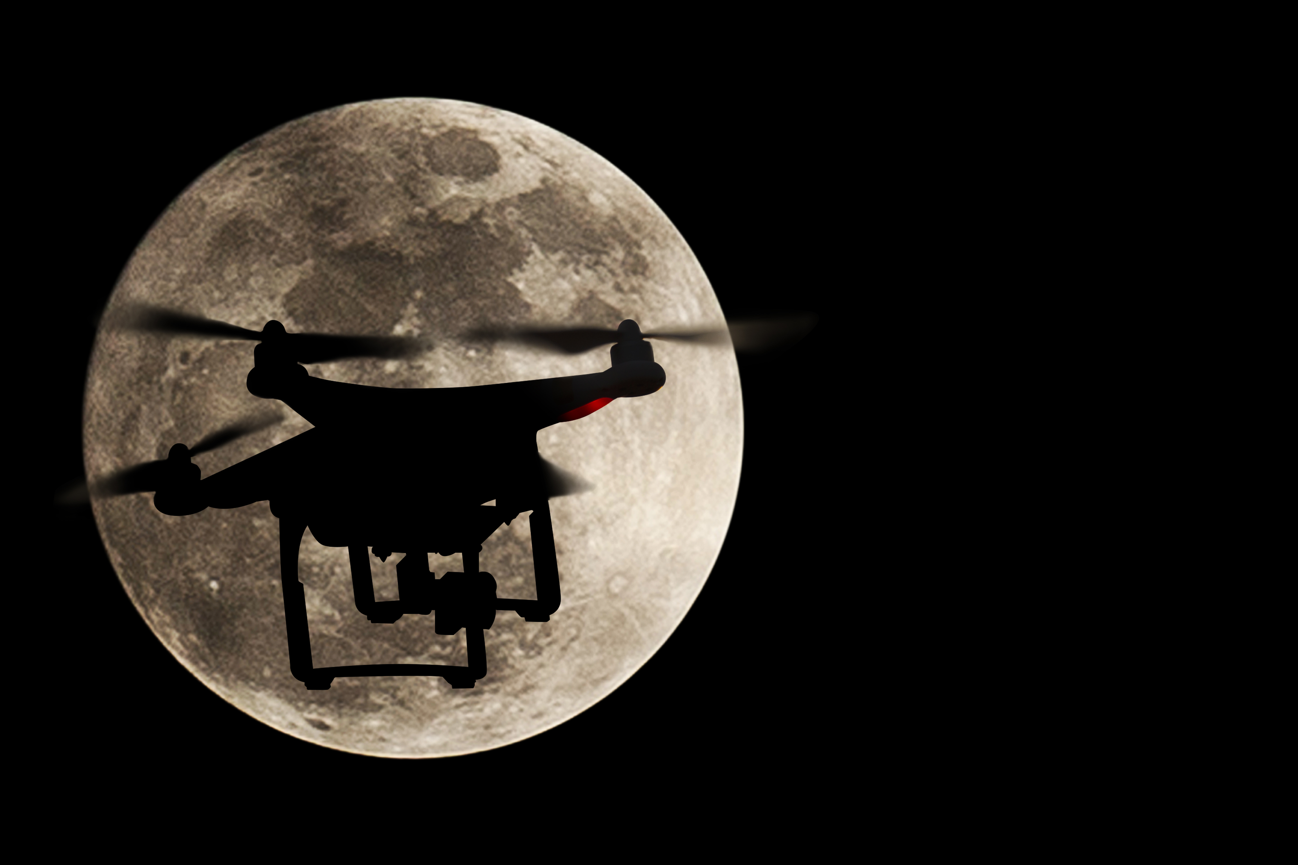 Drone in front of the moon. Photo