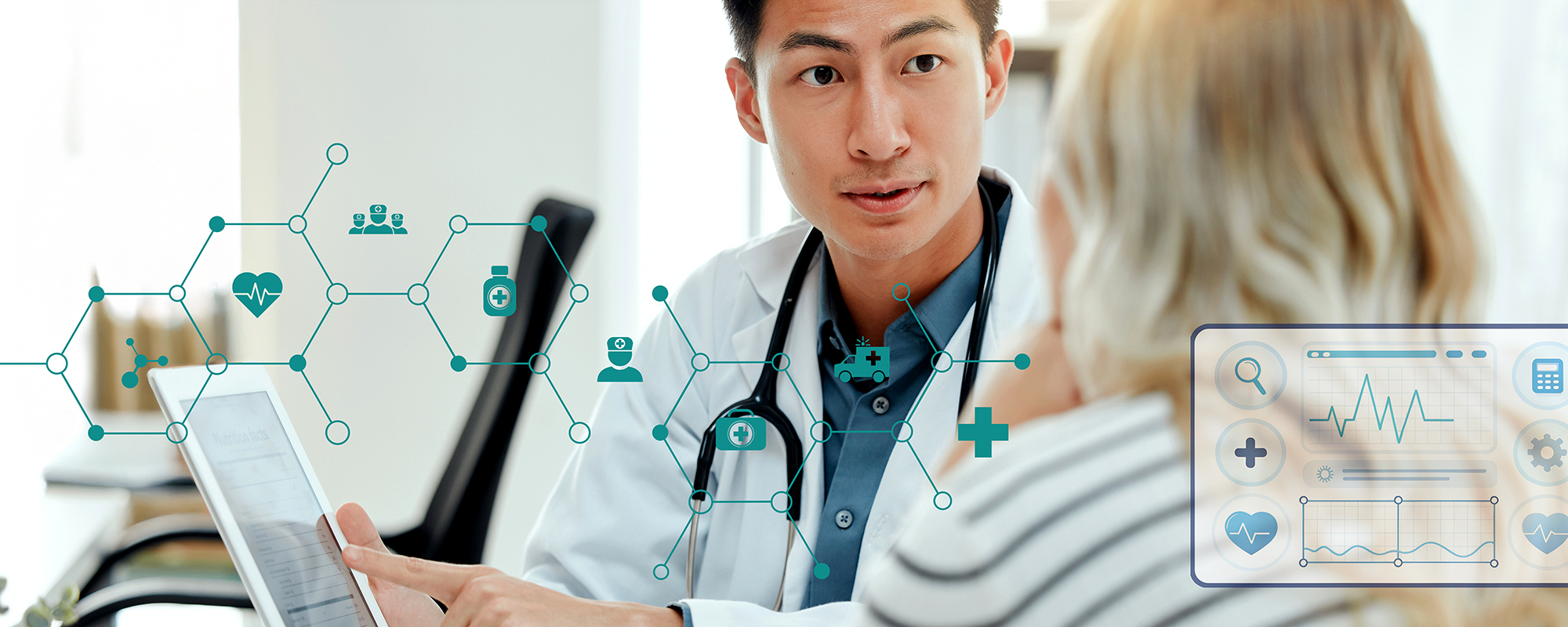 Person in medical clothes pointing at a digital screen