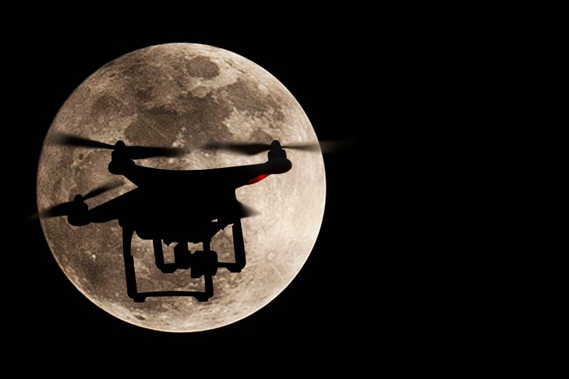 Drone with the moon in the background