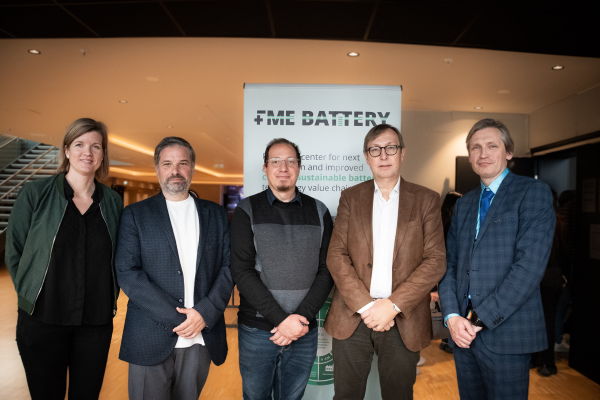 five people looking into the camera. photo