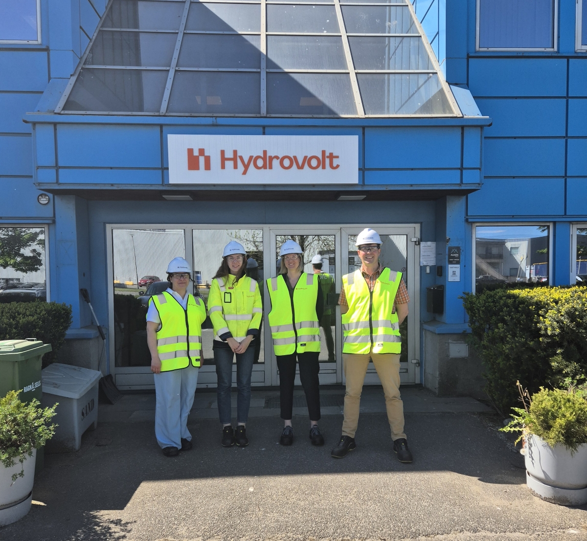 Four people outside Hydrovolt facilities
