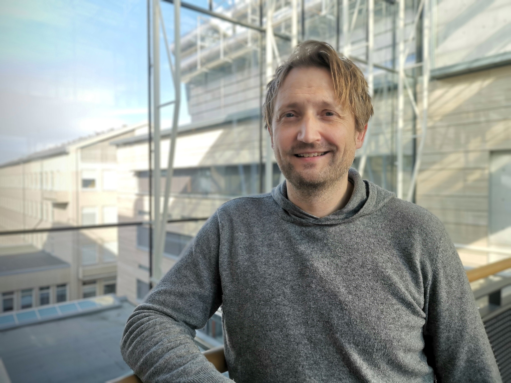 man in front of window. photo