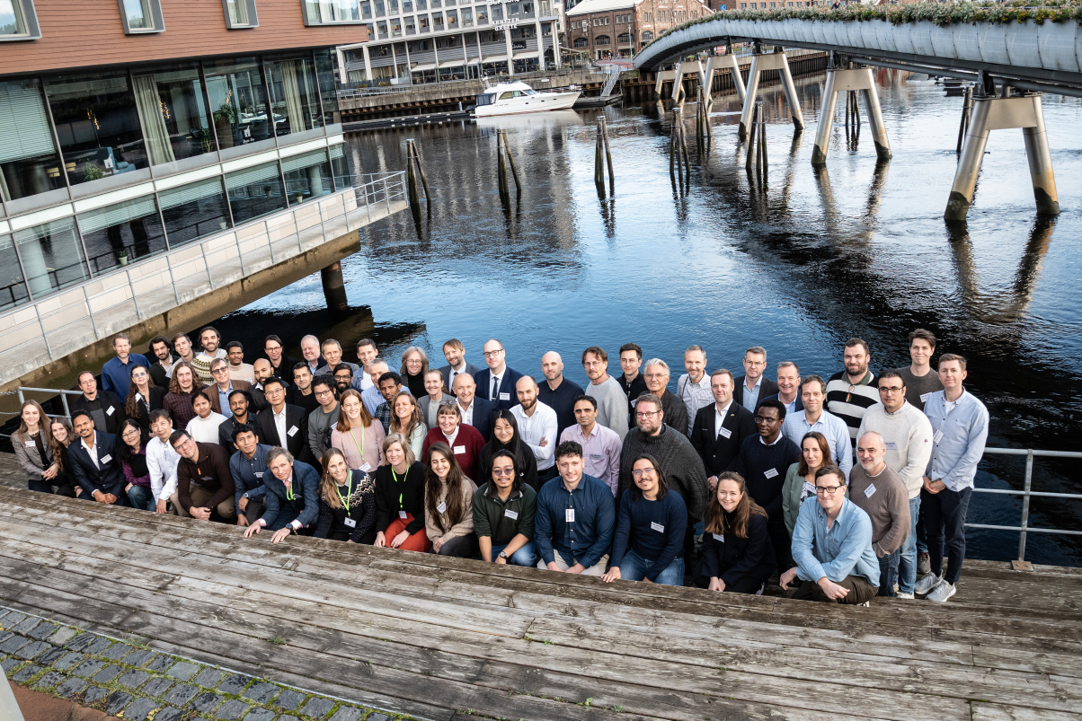 group in front of river. photo