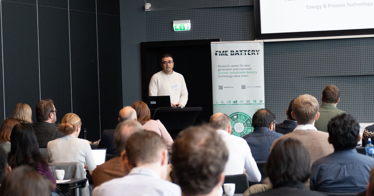 person giving presentation to a crowd. photo