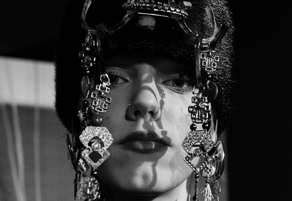A woman wearing a hat from Knappestøperen. Trøndelag Centre for Contemporary Art. Photo: Rosann Hammer.