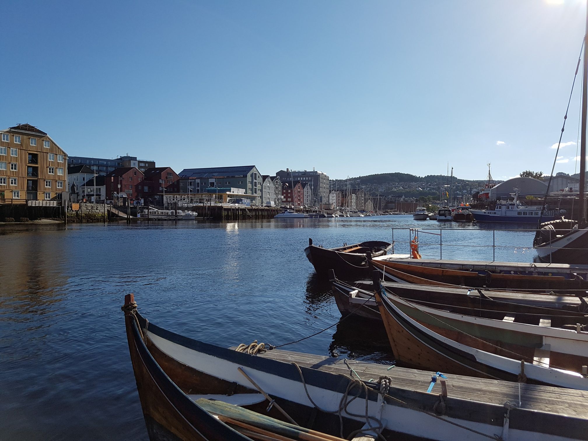 Boats and houses under a sunny sky