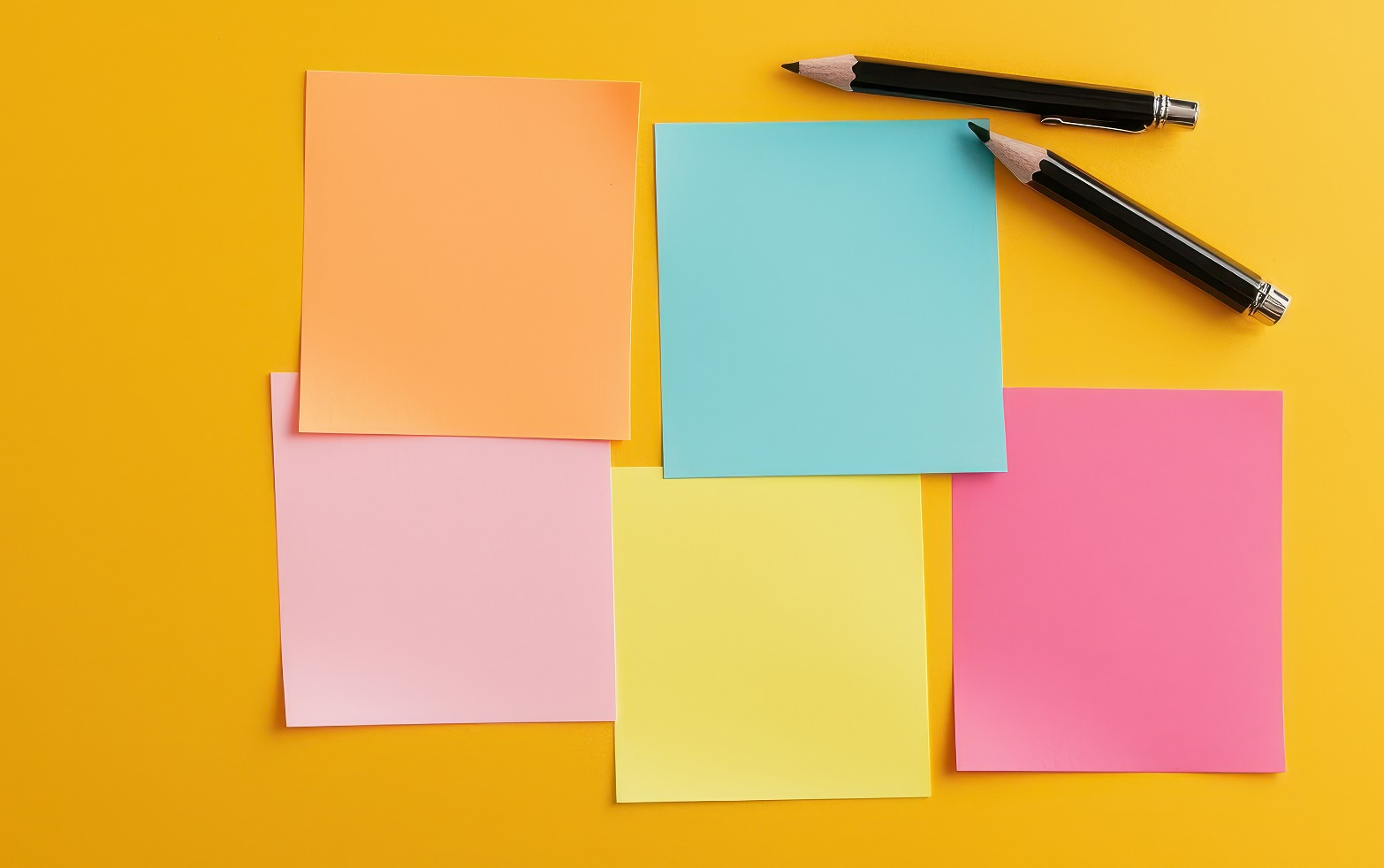 Five blank post it notes with different colours