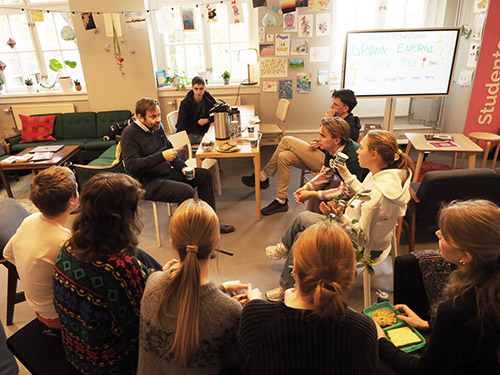 Professor and students discussing
