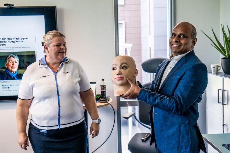 Professor Raghavendra Ramachandra demonstrating a face mask used in biometric security testing