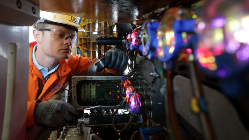 Man operating in a machine. Photo.