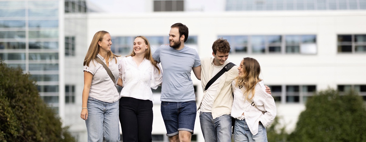 Five students outside Dragvoll, the university campus for humanities and social sciences