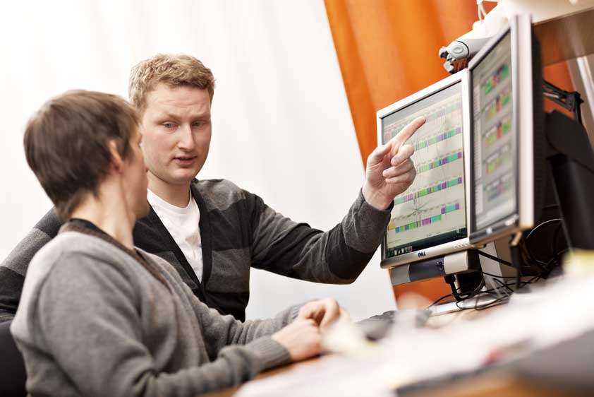 Two researchers discuss what they see on screens