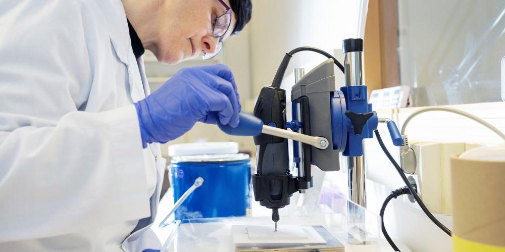 Woman in lab with technical equipment